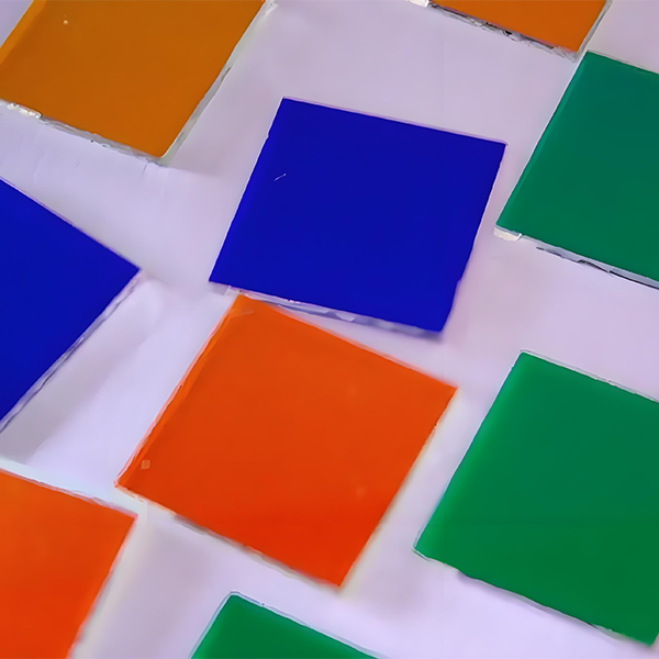 Microscopic view of color filter pixels showing red, green, and blue elements separated by black matrix lines